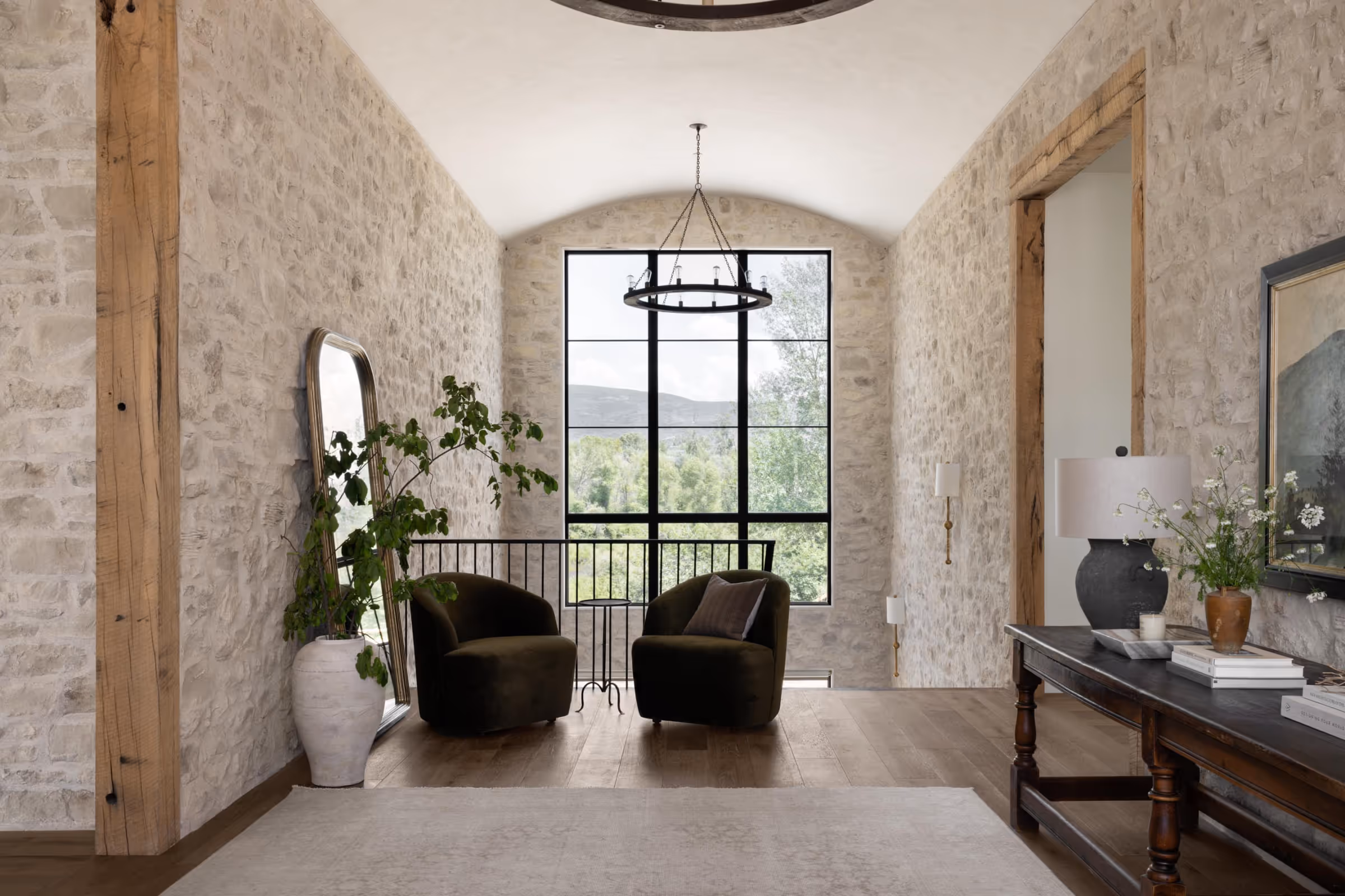 A large open plan landing with exposed stone walls.