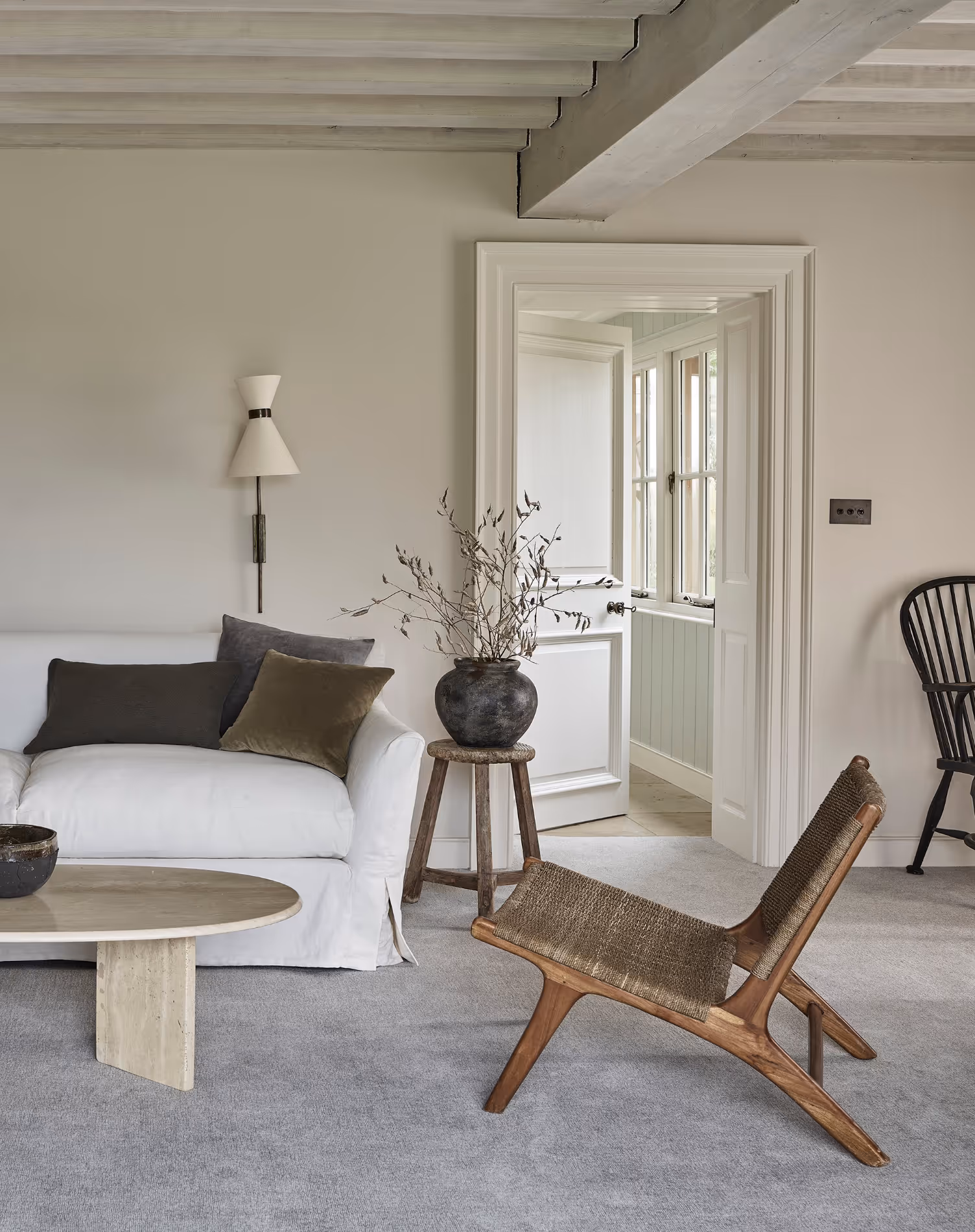 A bedroom with a luxurious 100% wool carpet in a light grey colour.