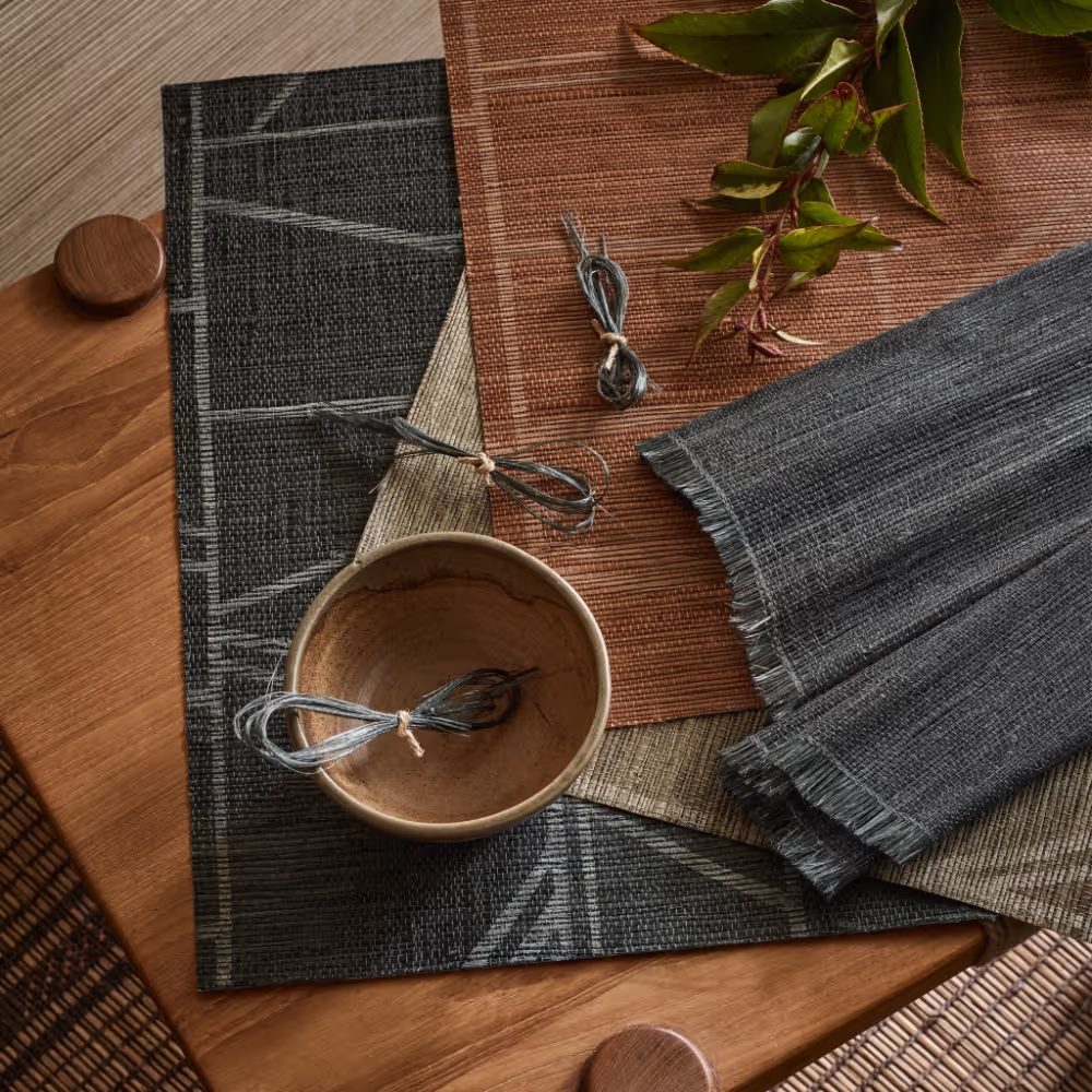 A selection of eco friendly grasscloth wallcoverings in colours of slate and terracotta.