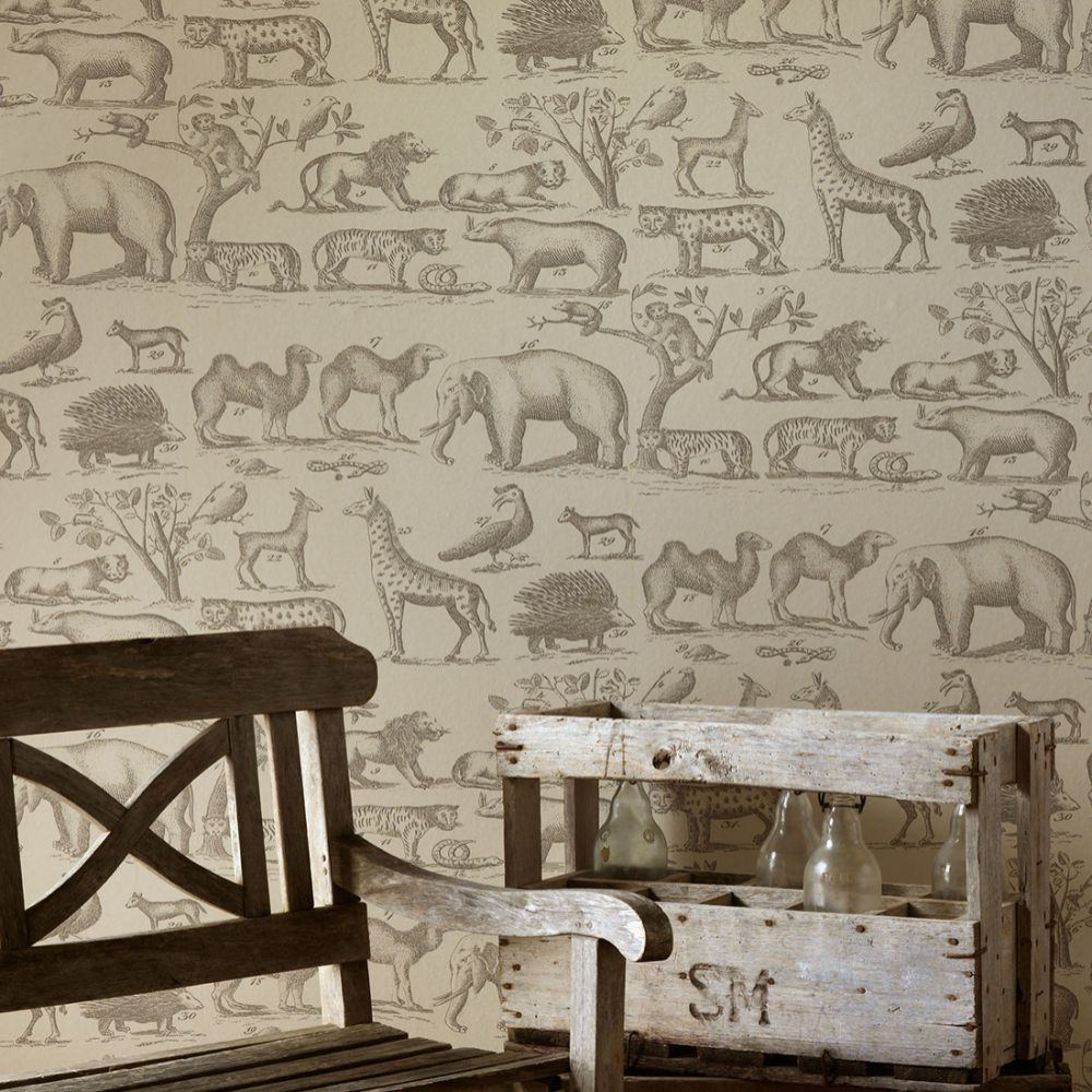 A wall papered in an animal print in neutral tones.