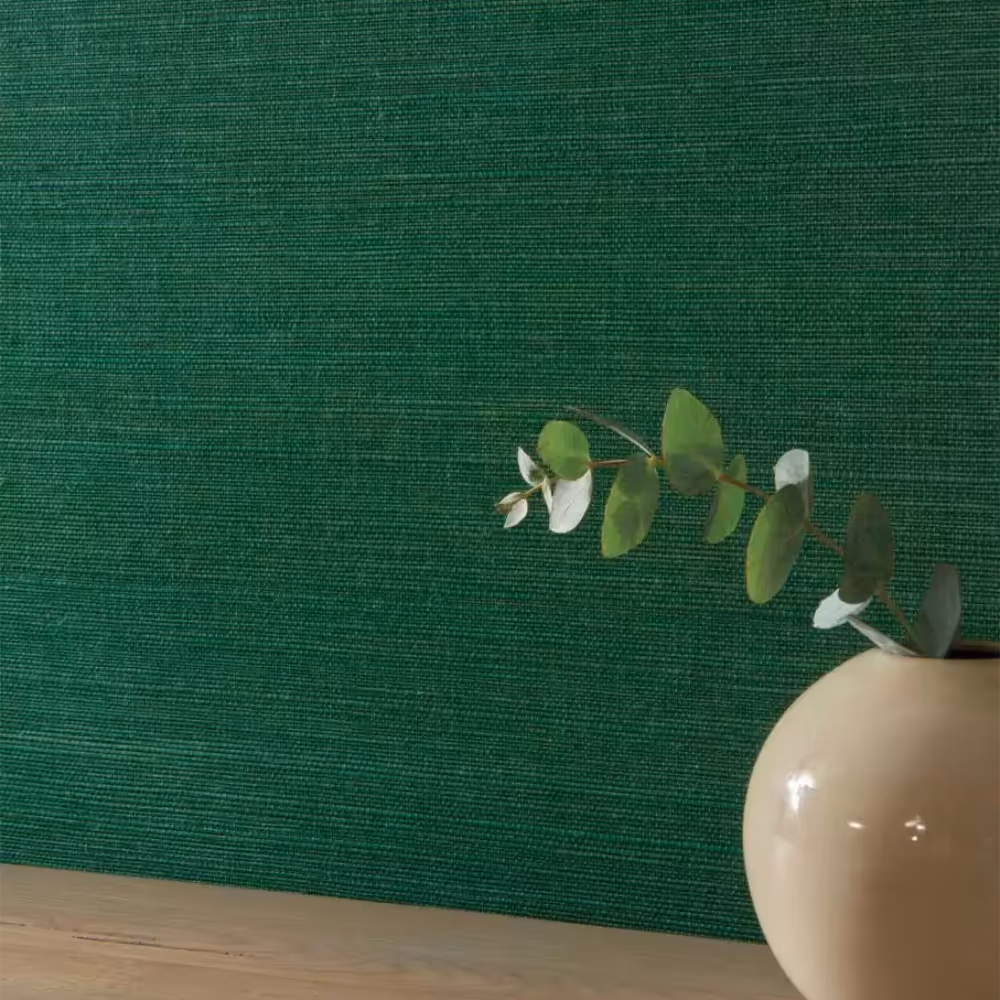A bright emerald green grasscloth wallcovering